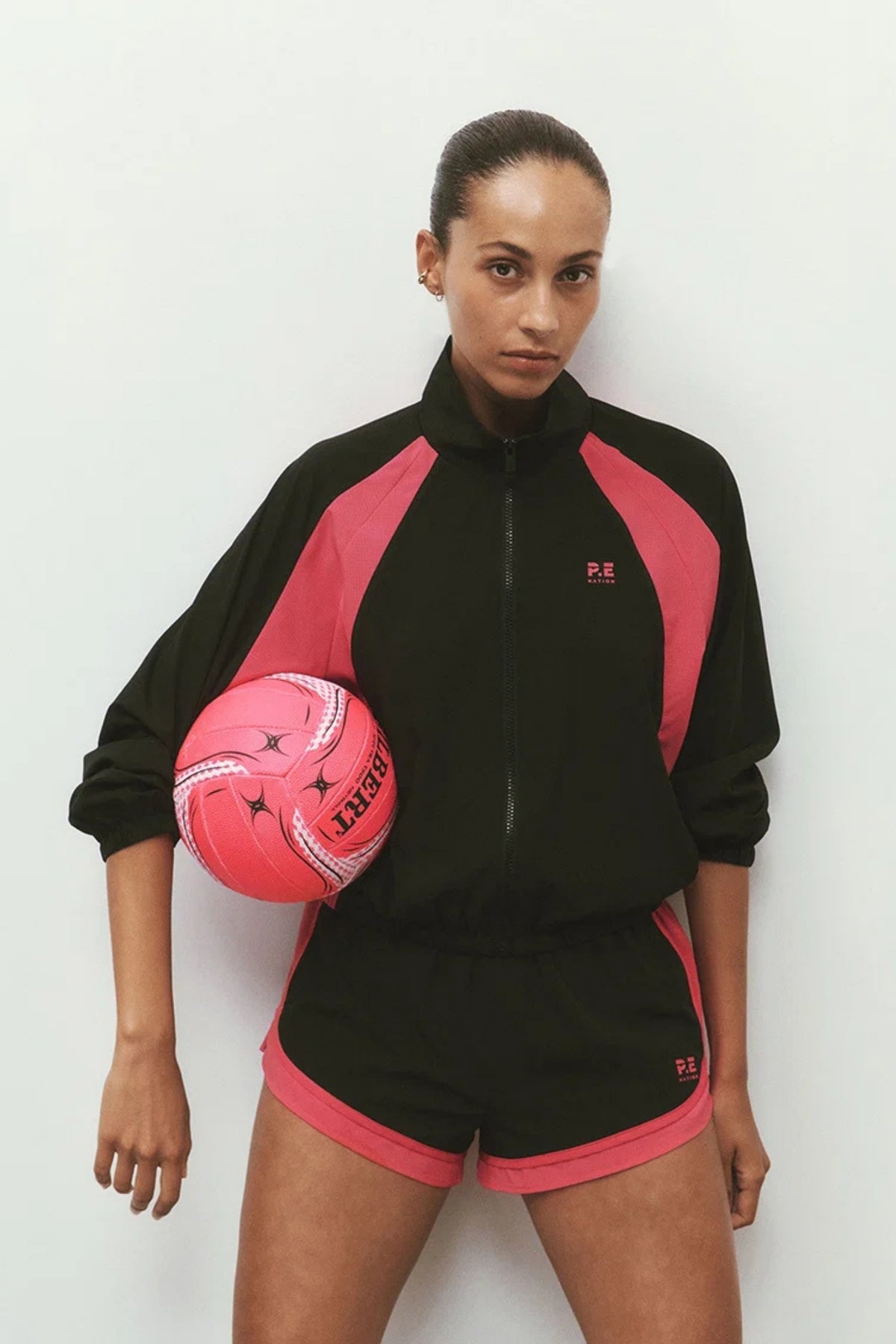 STRIDE JACKET IN BLACK AND COSMO PINK