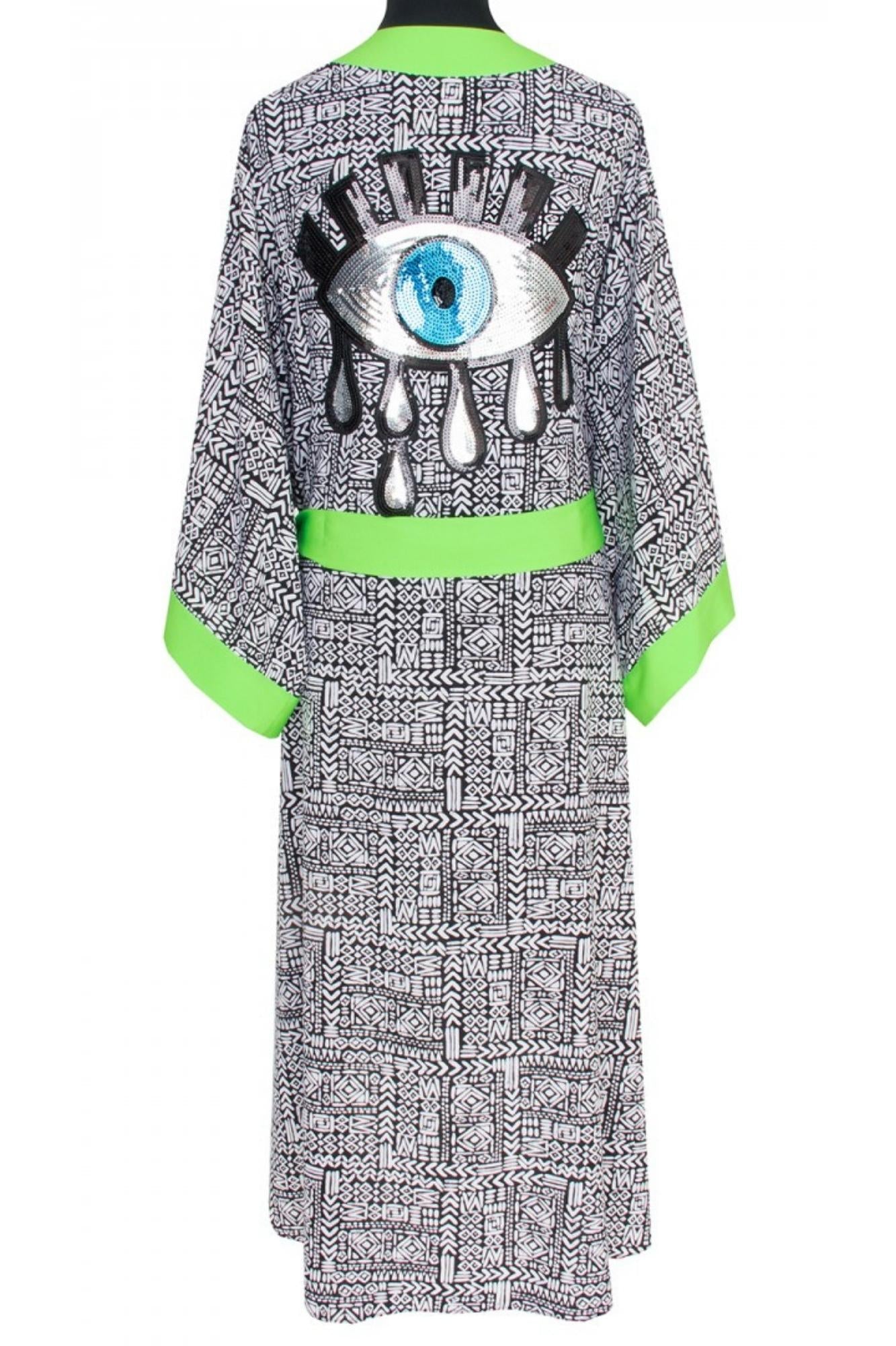 Kimono - Tribal print, with neon green finish.  - Neon green belt and trim  - Neon green tassels on the sides (except for Short Angel-Cut Kimono)  - Sequins evil eye patch on the back